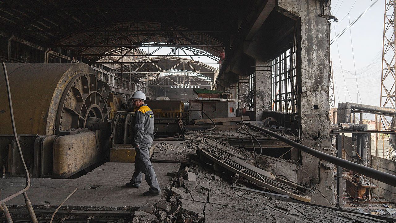 A worker walks inside DTEK's power plant which was destroyed by a Russian missile attack in Ukraine