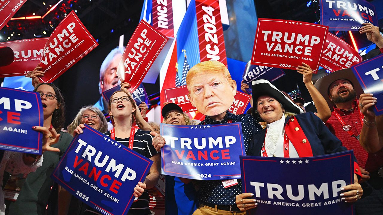 Attendees hold signs and cheer during the second day of the 2024 Republican National Convention at the Fiserv Forum in Milwaukee, Wisconsin, July 16th 2024