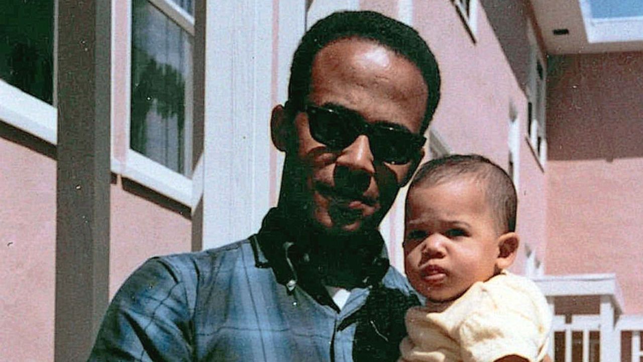 Donald Harris holds his baby daughter Kamala, April 1965