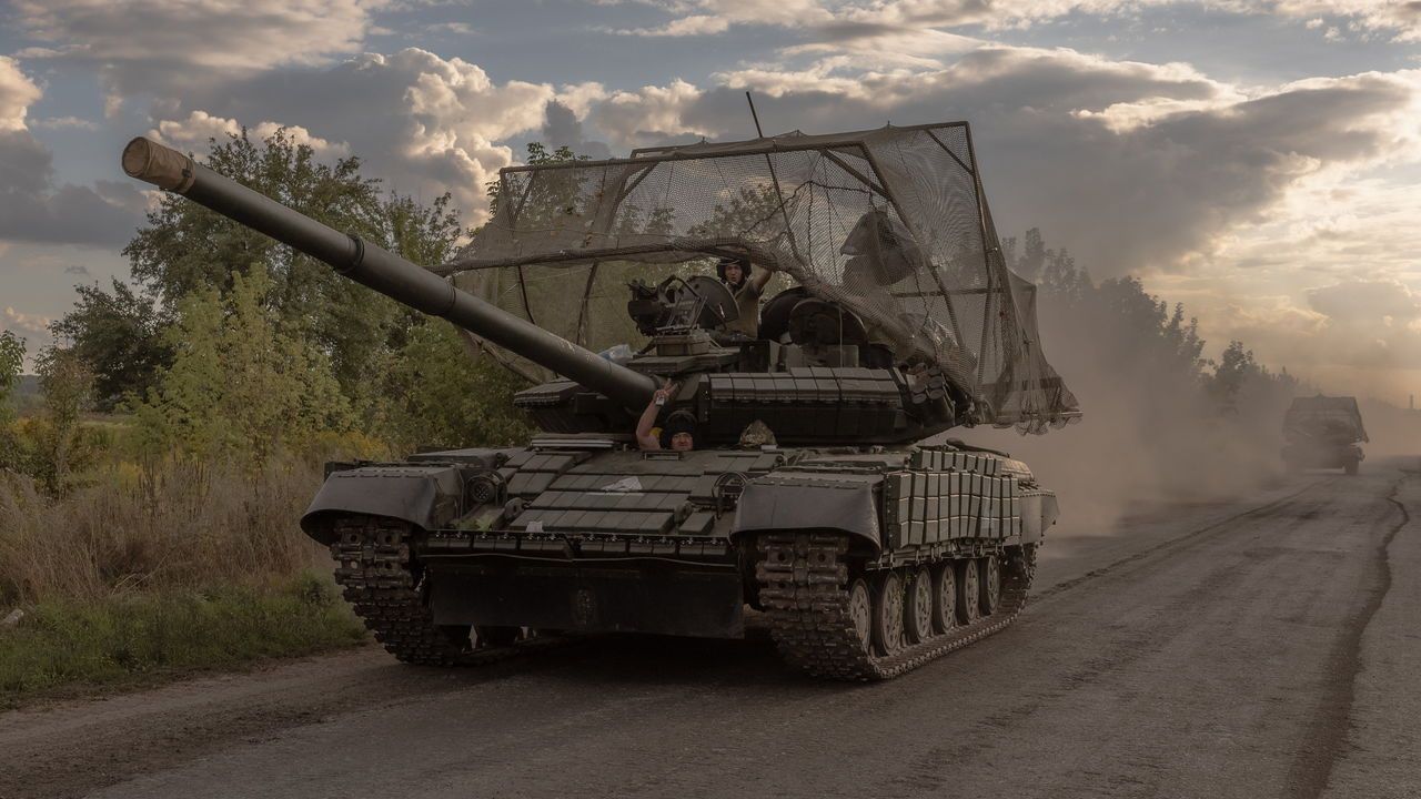 Ukrainian servicemen drive Soviet-made T-64 tanks in the Sumy region, near the border with Russia.