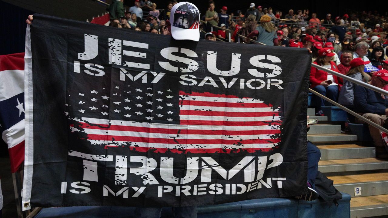 A rally to support former President Donald Trump in his reelection bid in Rome, Georgia, USA. A banner reads 'Jesus is my savior. Trump is my president'.