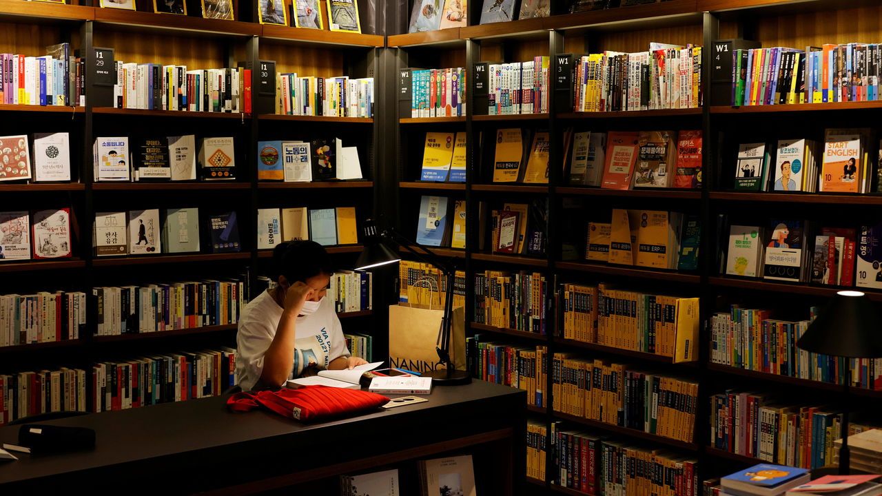 A woman reads a book at a bookshop in Seoul, South Korea, September 22nd 2020