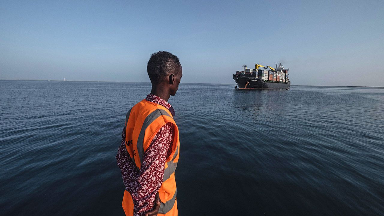 A port worker looks on as a container vessel approached the port of Berbera, Somaliland