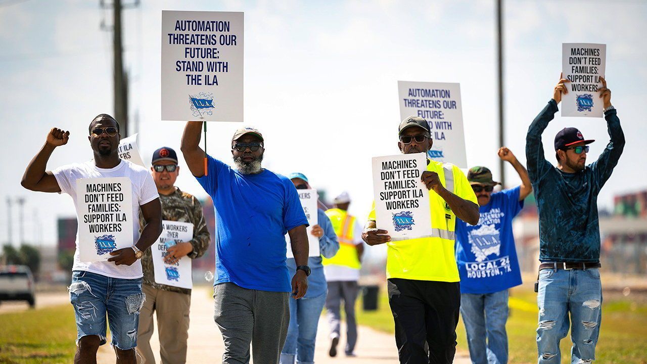 Longshoremen walk the picket line at the Barbours Cut Container Terminal.